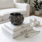 handmade metallic black face planter with sculptural geometric design