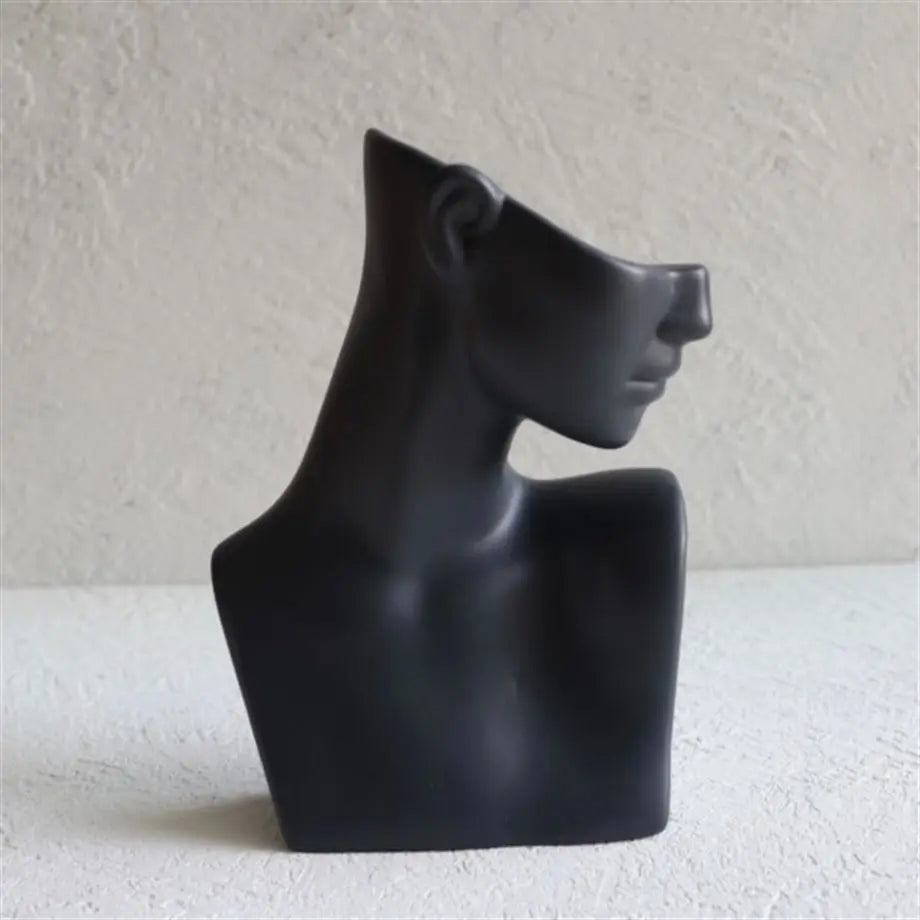 decorative black female bust sculpture styled on a shelf