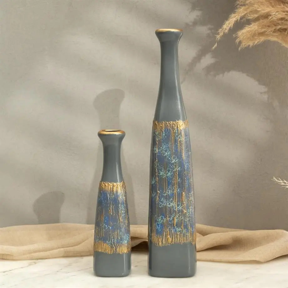 two piece tall ceramic vase set styled on a modern console table
