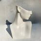decorative white female bust sculpture styled on a shelf