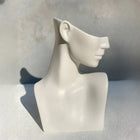 decorative white female bust sculpture styled on a shelf