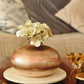 decorative flat ceramic vase styled on a console table in a modern interior