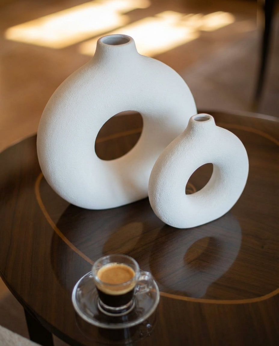 decorative cream ring ceramic vase styled on a modern console table
