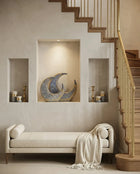 decorative crescent ceramic sculpture styled on a modern console table