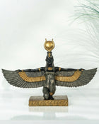 decorative egyptian goddess sculpture styled on a modern console table