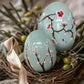 light green ceramic easter egg decorations styled on a spring table