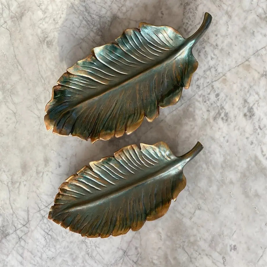 decorative leaf tray set styled on a coffee table with candles