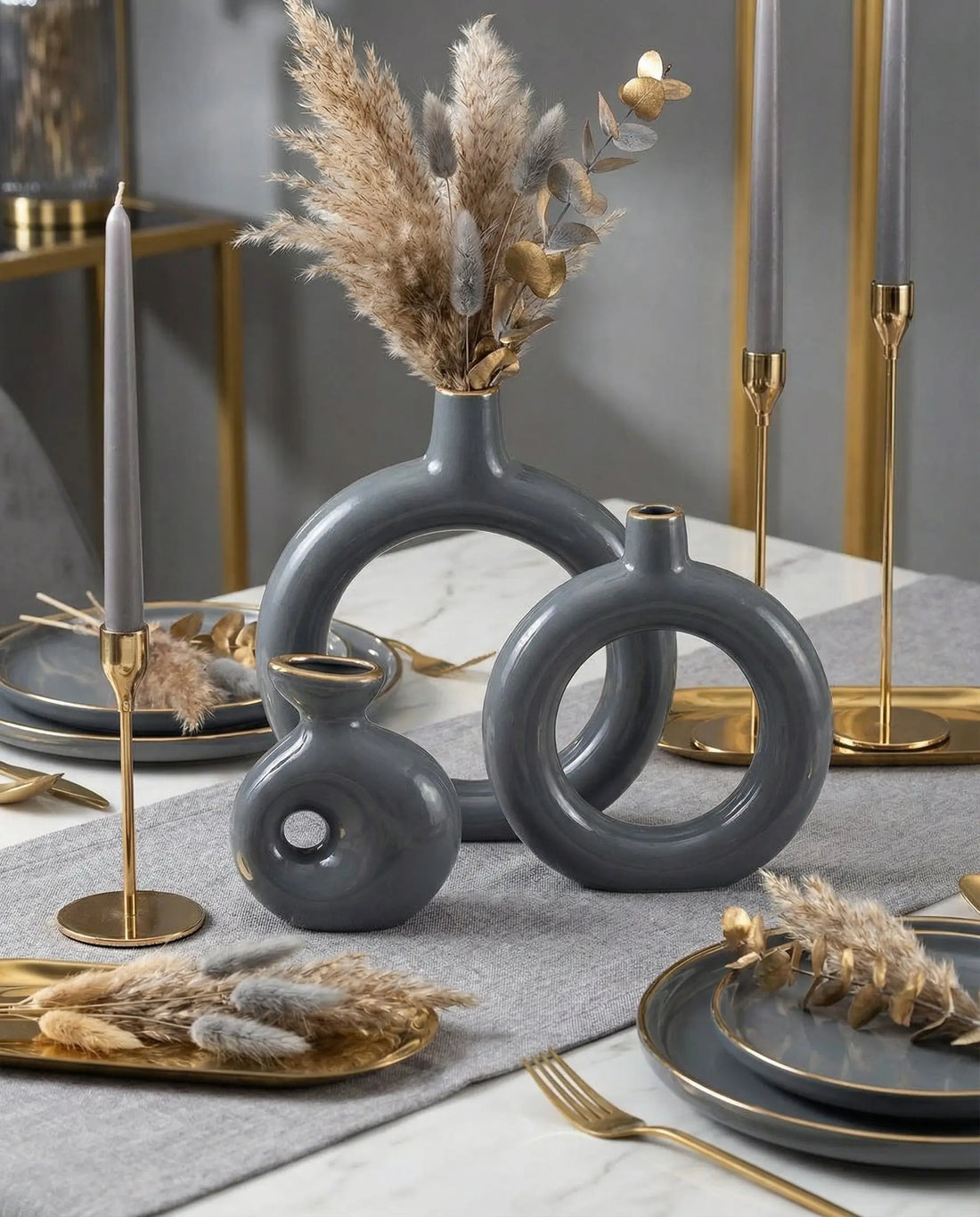 sculptural grey and gold ring ceramic vases styled on a modern console table