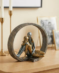 handmade circular sculptural decor object in anthracite gold and silver