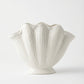 handmade white ceramic vase with sculptural seashell design for modern interiors