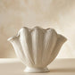 handmade white ceramic vase with sculptural seashell design for modern interiors