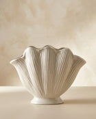 handmade white ceramic vase with sculptural seashell design for modern interiors