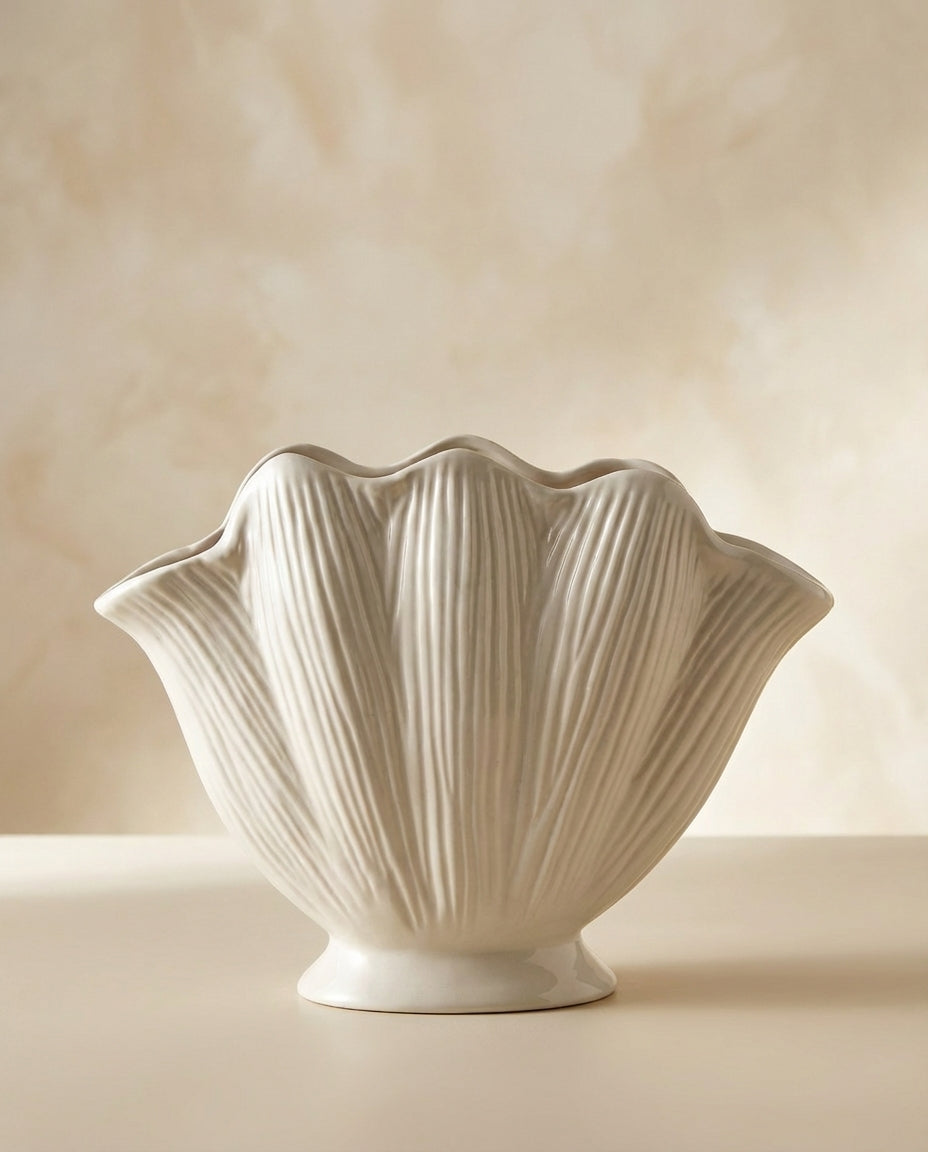 handmade white ceramic vase with sculptural seashell design for modern interiors