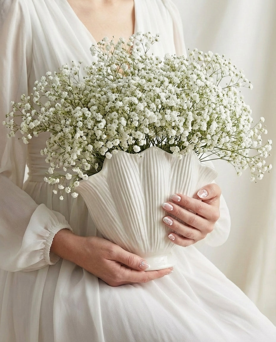 handmade white ceramic vase with sculptural seashell design for modern interiors