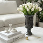 matte black sculptural decorative vase styled on a modern console table