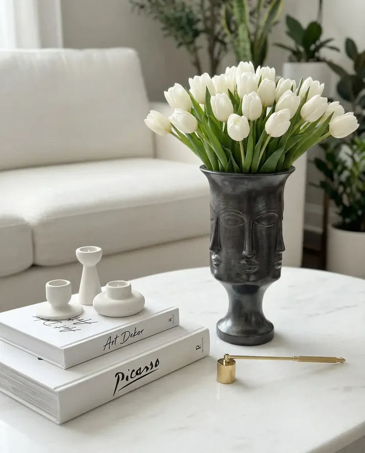 matte black sculptural decorative vase styled on a modern console table