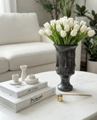 matte black sculptural decorative vase styled on a modern console table