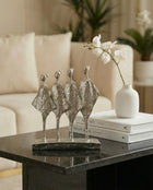 modern silver abstract sculpture decor styled on a console table