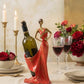 handmade pomegranate red woman wine holder sculpture holding a wine bottle