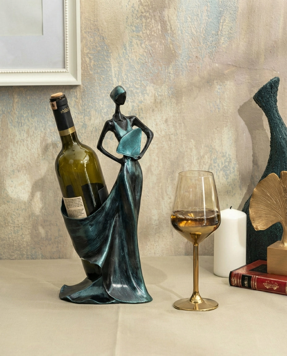 decorative sculptural wine holder in petrol green styled on a dining table