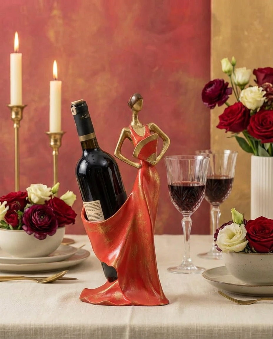 decorative sculptural wine holder in pomegranate red styled on a dining table