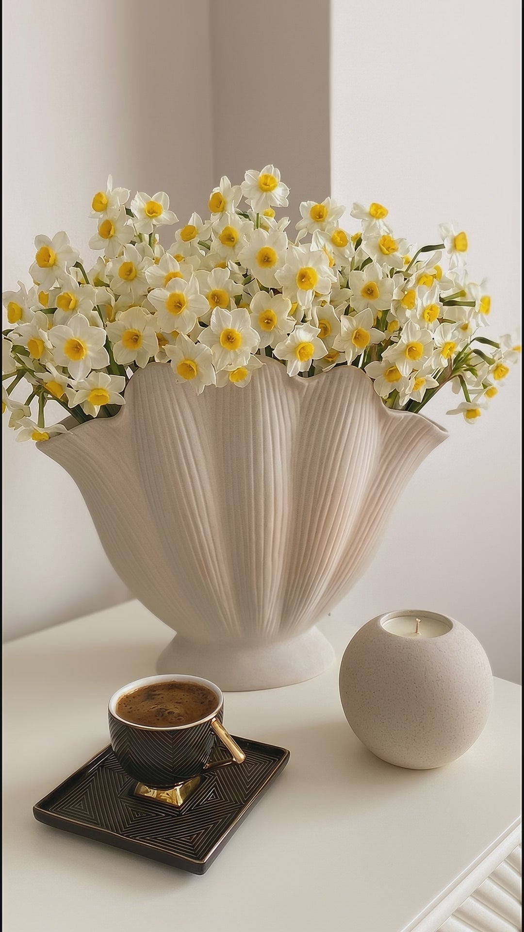modern white ceramic decorative vase styled on a console table