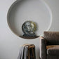 decorative sun and moon sculpture styled on a modern console table