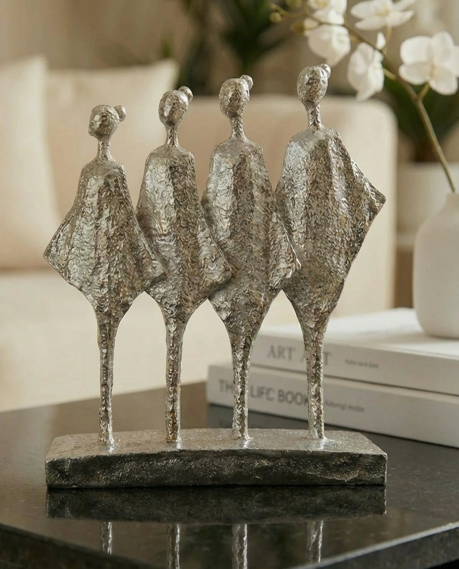 handmade silver abstract sculpture with four figures symbolising unity and balance
