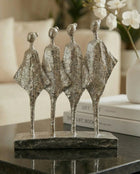 handmade silver abstract sculpture with four figures symbolising unity and balance