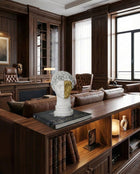 white and gold hermes bust decorative sculpture styled on a console table