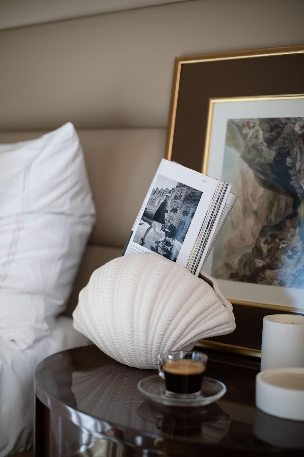 sculptural oyster shell ceramic vase styled on a console table